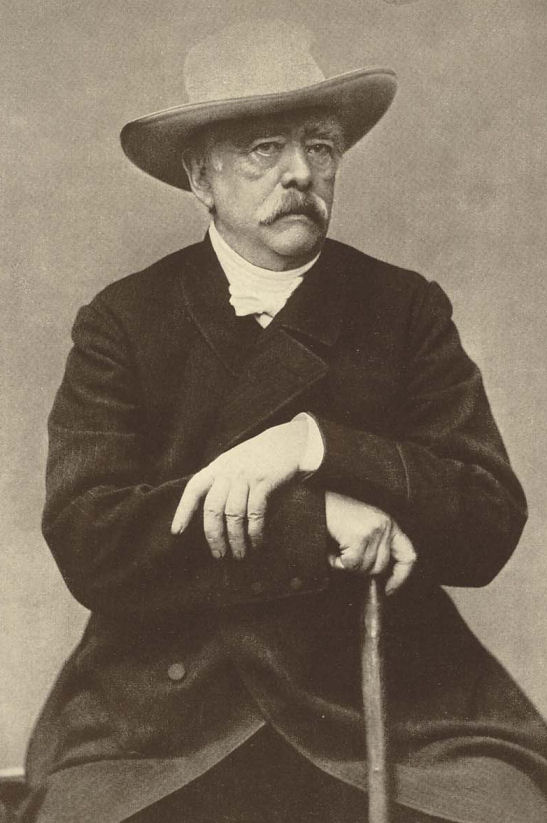 Bismarck in his garb as a farming landowner and owner of vast richly forested estates — purchased with the huge sums given him by grateful Prussian parliaments following the expansion of Prussia via its Bismarck-precipitated wars with Austria and France, and also with riches he accrued through insider dealings based on his own knowledge of what he was about to do.